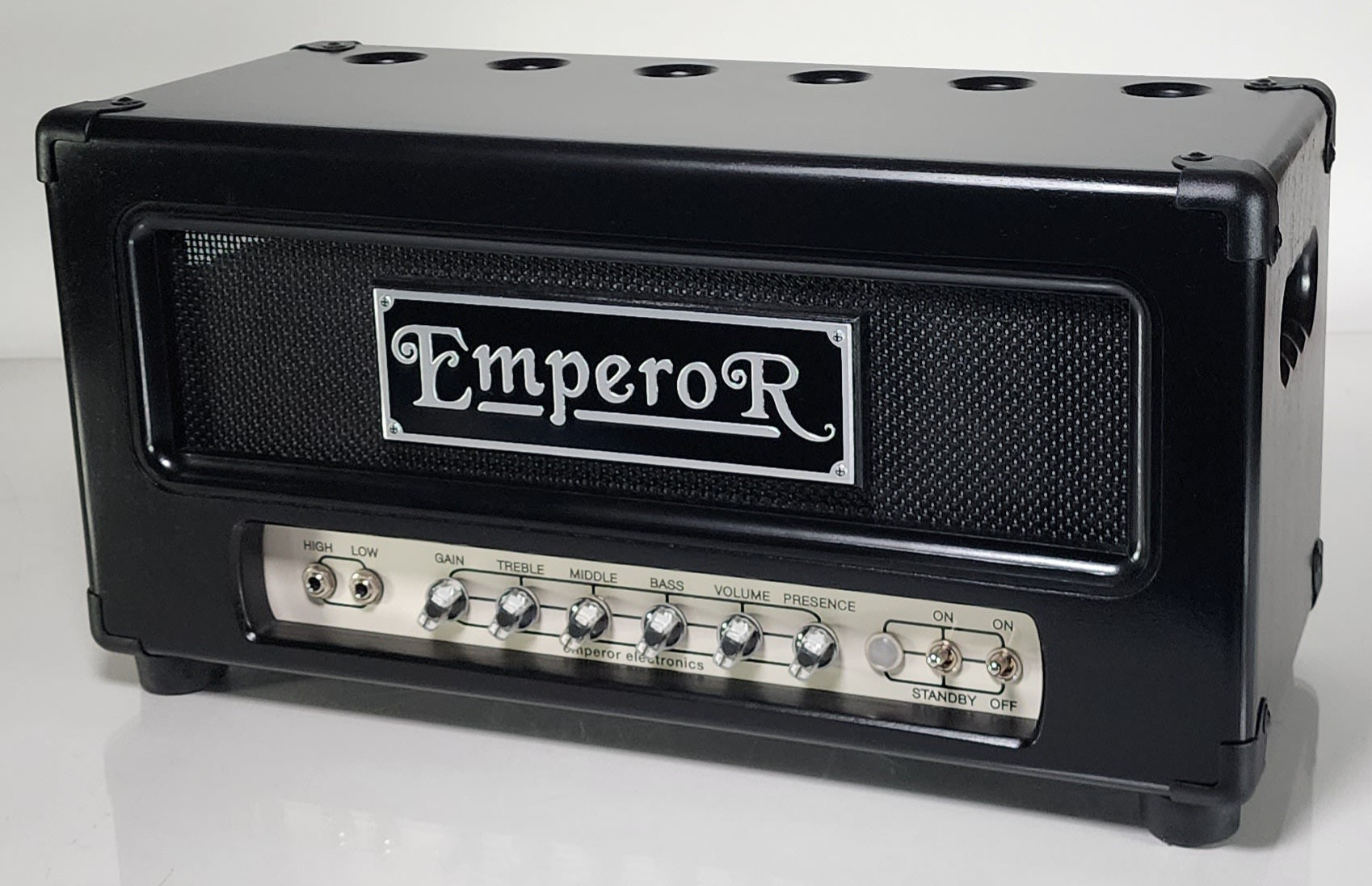 a black 100 watt tube guitar amplifier with a black grille