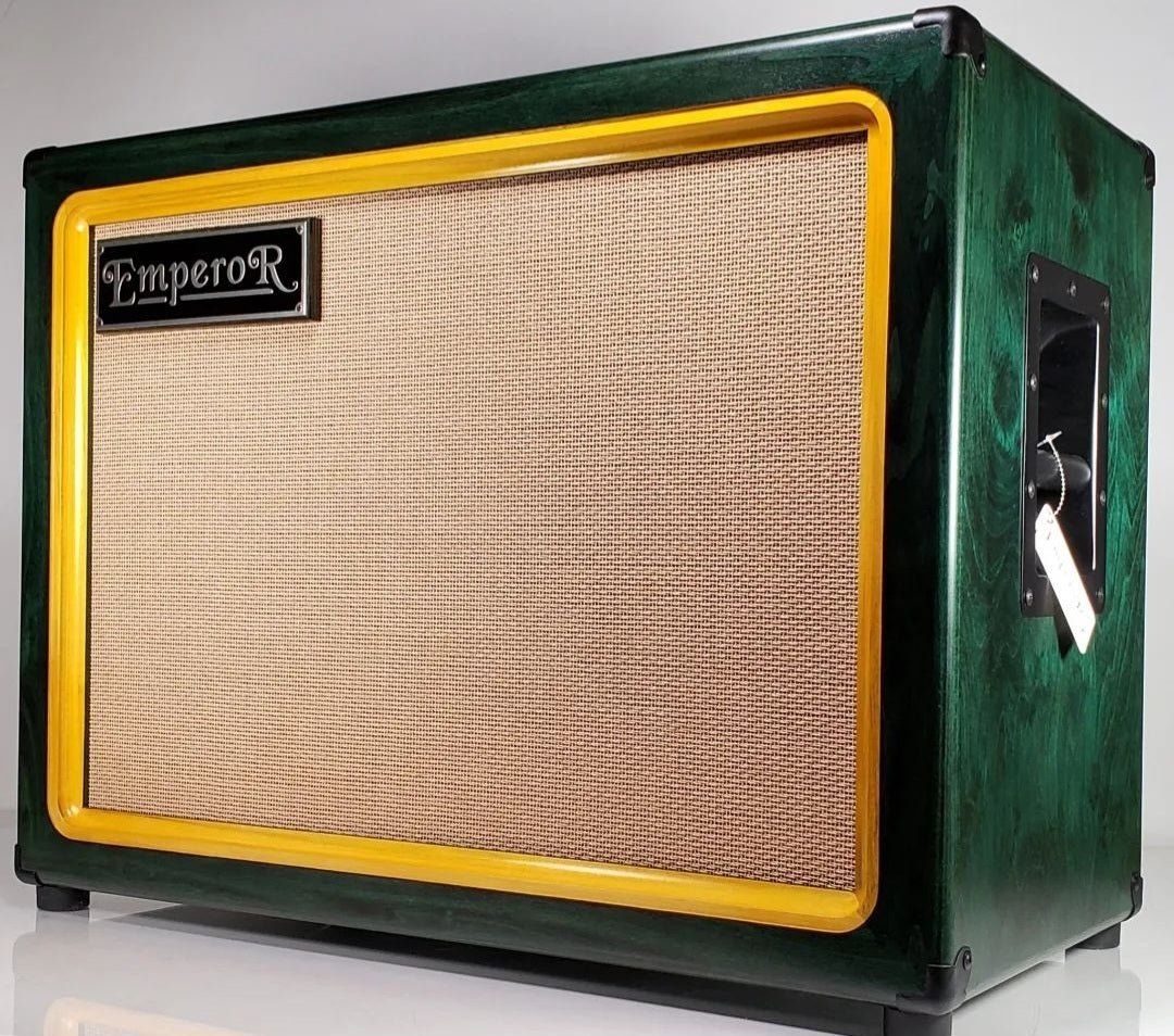 a green and amber 2x12 guitar speaker cabinet