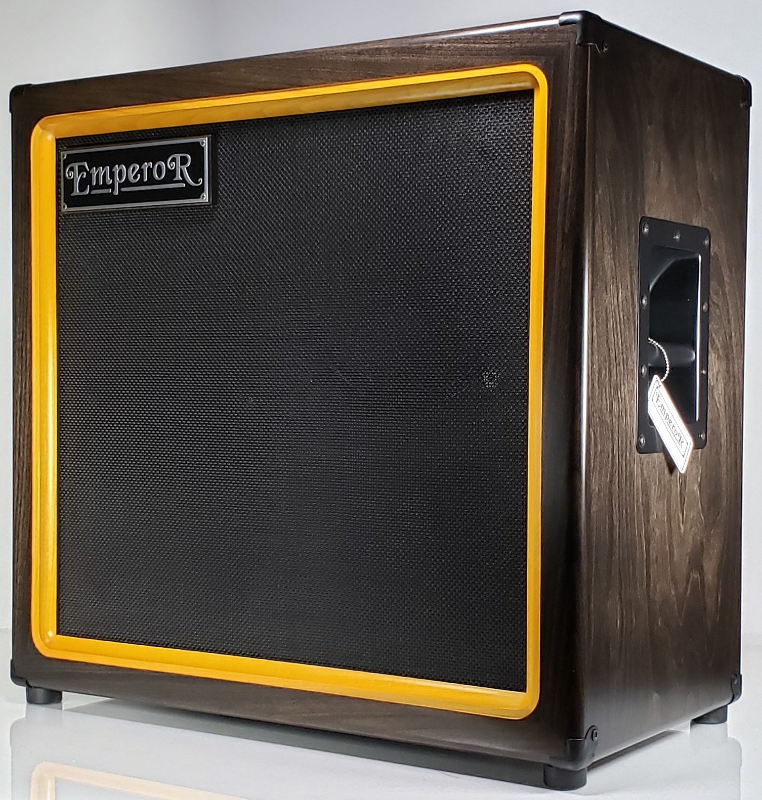 an oversized 2x12 guitar speaker cabinet with a dark stain