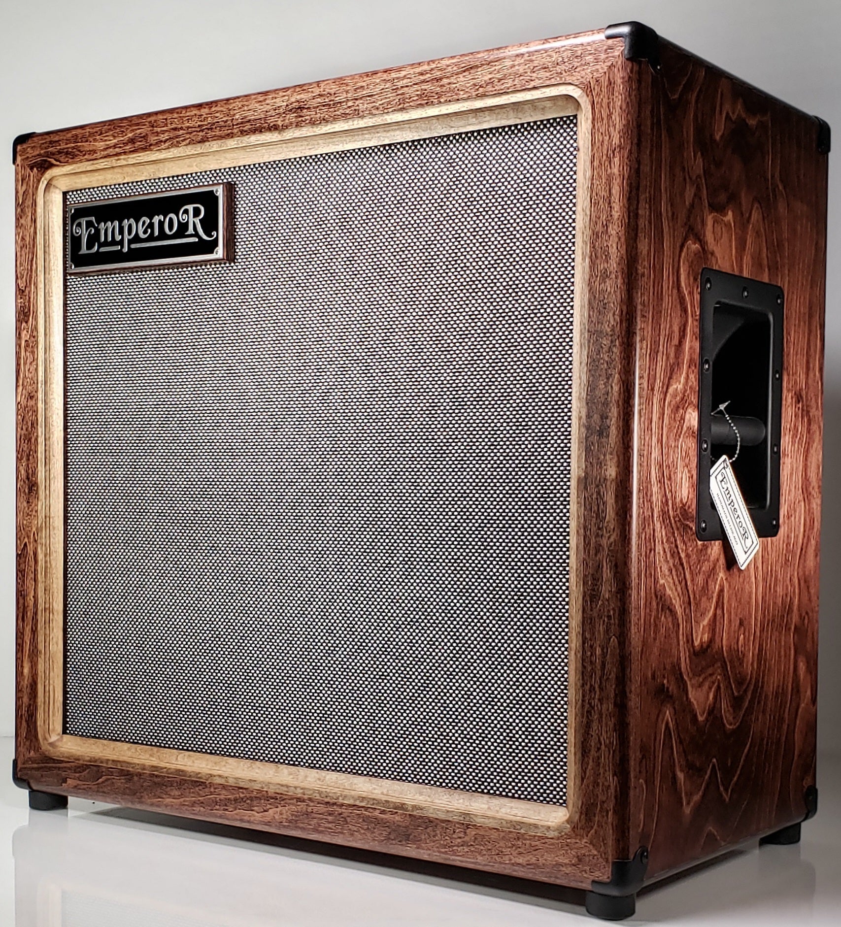 an oversized 2x12 guitar speaker cabinet with a black and silver grille