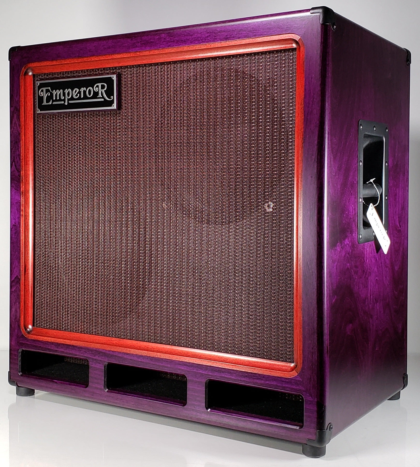 a purple and red 2x12 bass speaker cabinet