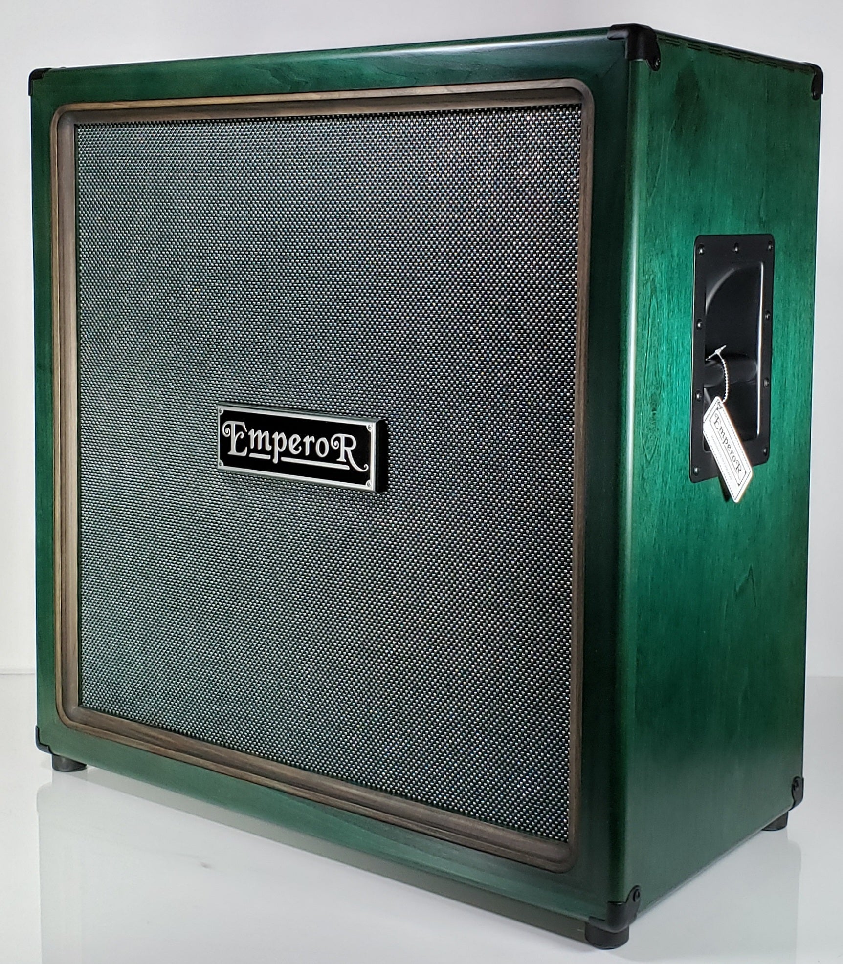 an oversized 4x12 guitar speaker cabinet with a green grille