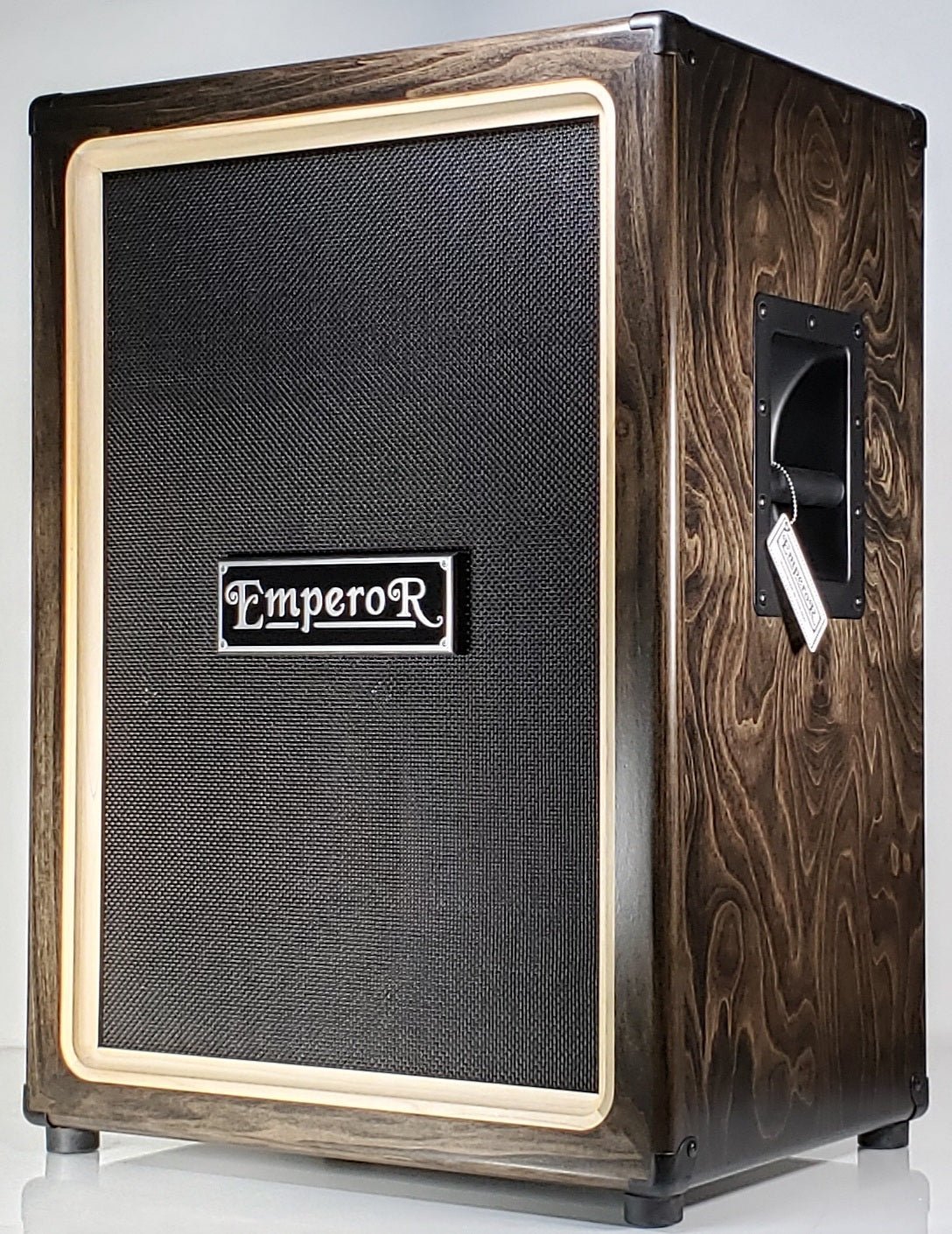 a vertical 2x12 guitar speaker cabinet with a black grille