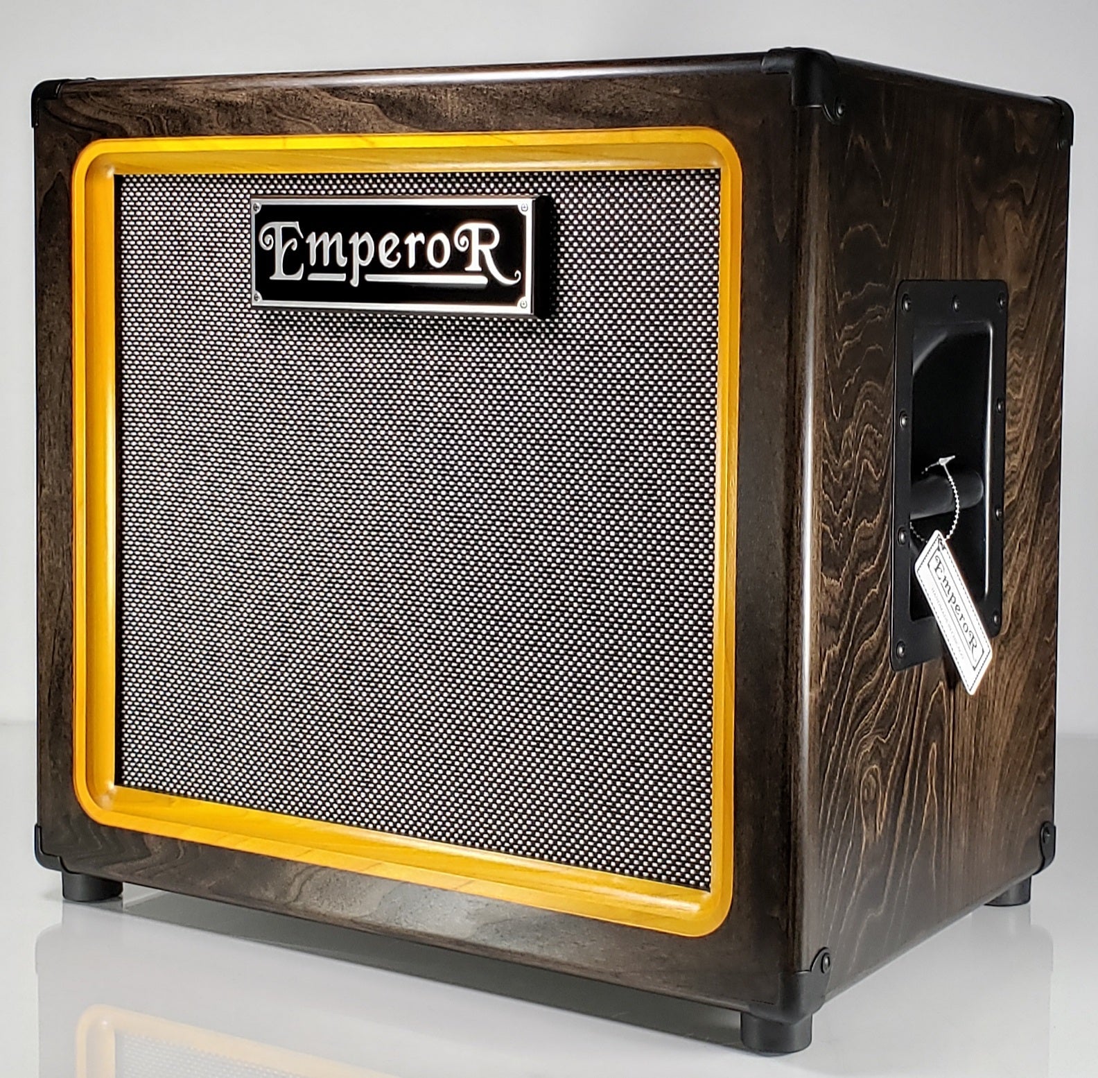 a 1x12 guitar speaker cabinet with a black and silver grille