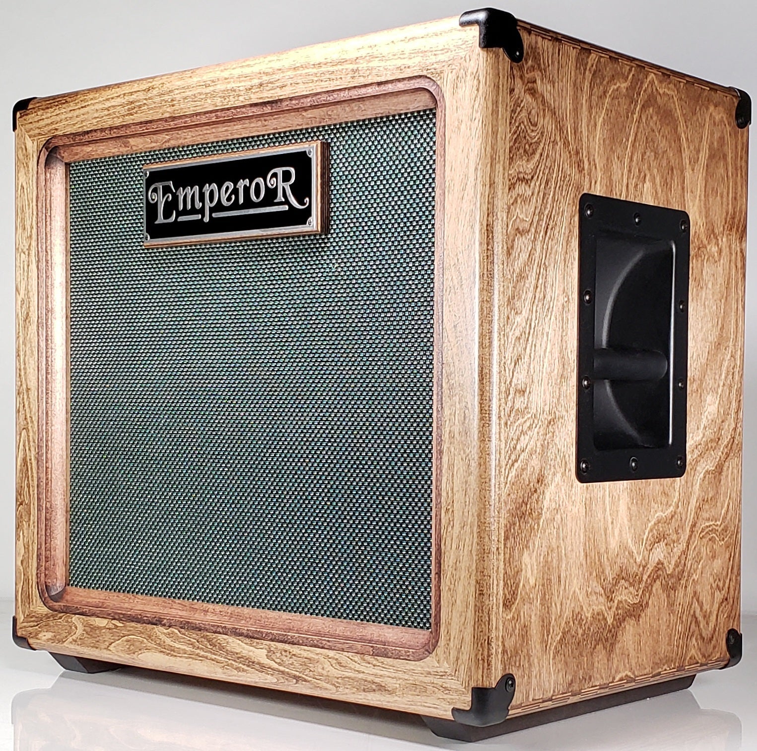 a custom made 1x12 guitar speaker cabinet with a green grille