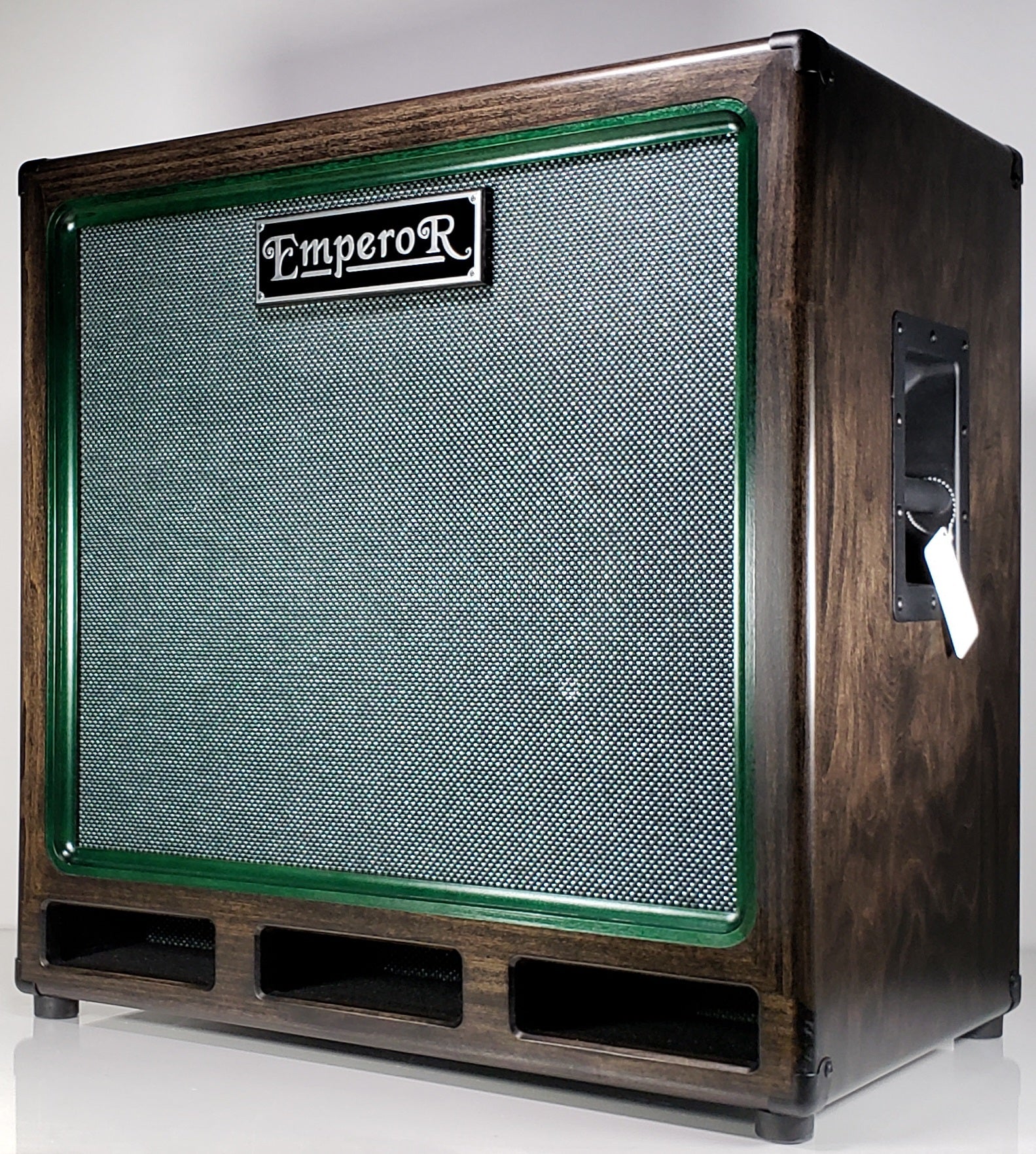 a 1x15 bass speaker cabinet with a green grille