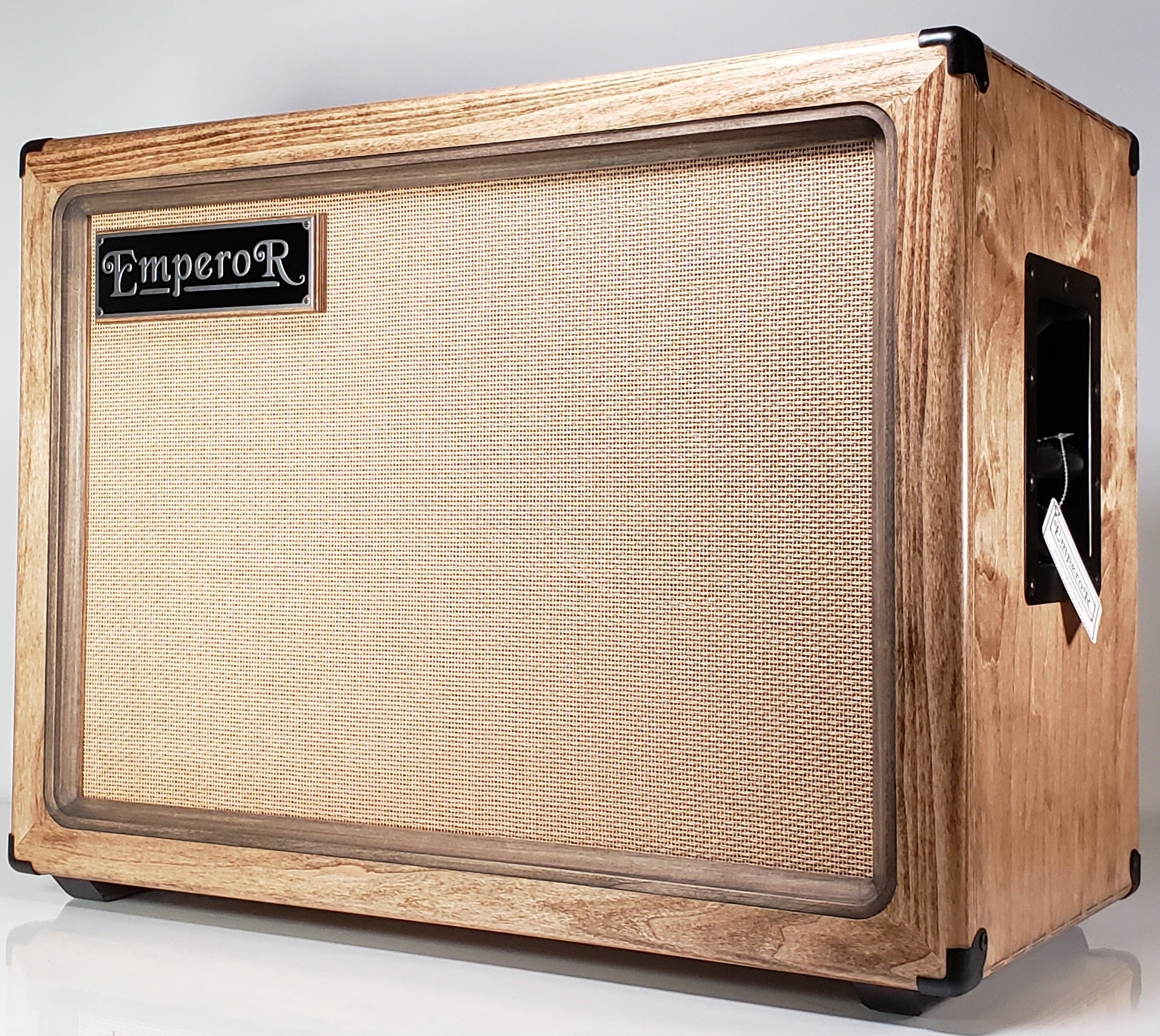 a 2x12 guitar speaker cabinet with a tan grille