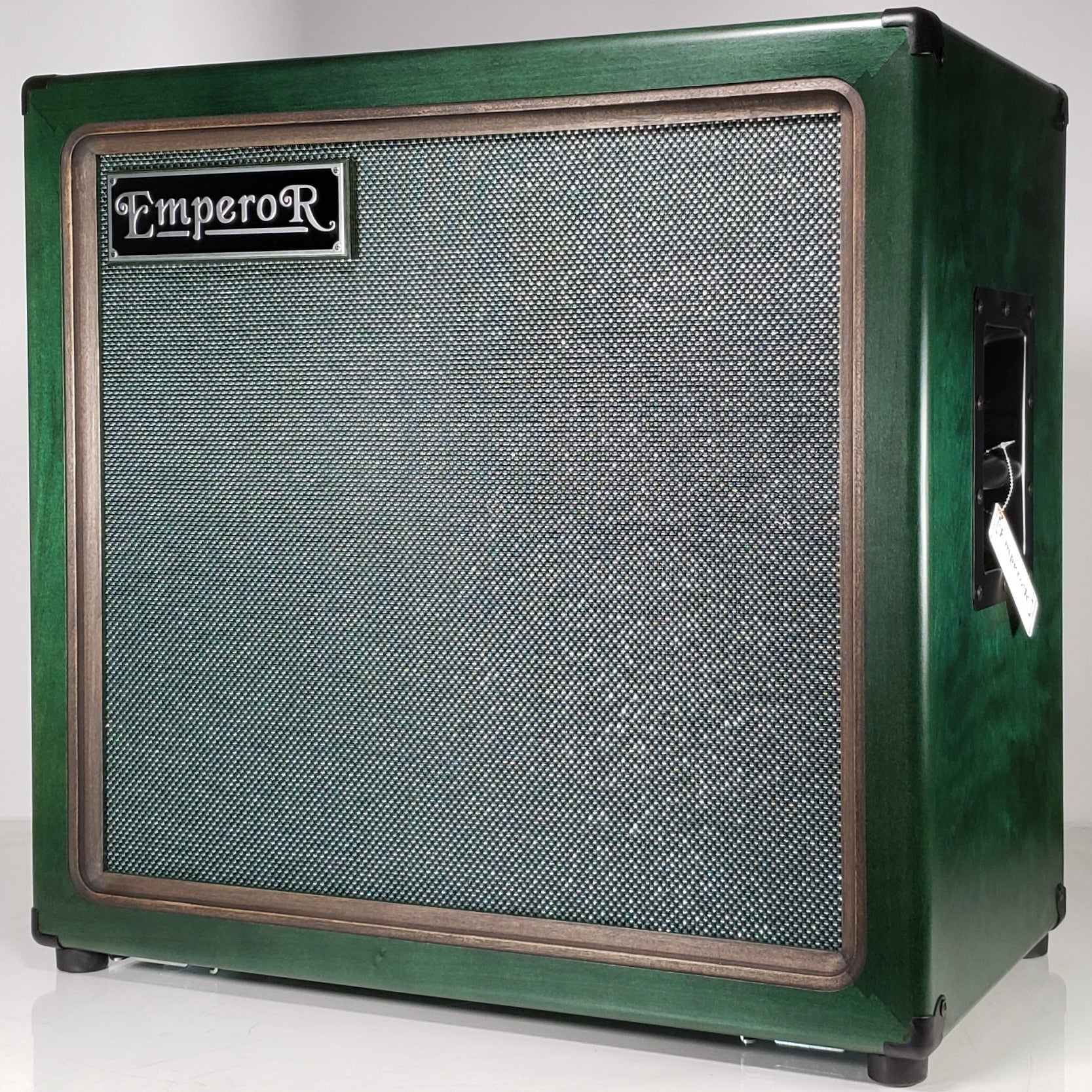 a green oversized 2x12 guitar speaker cabinet