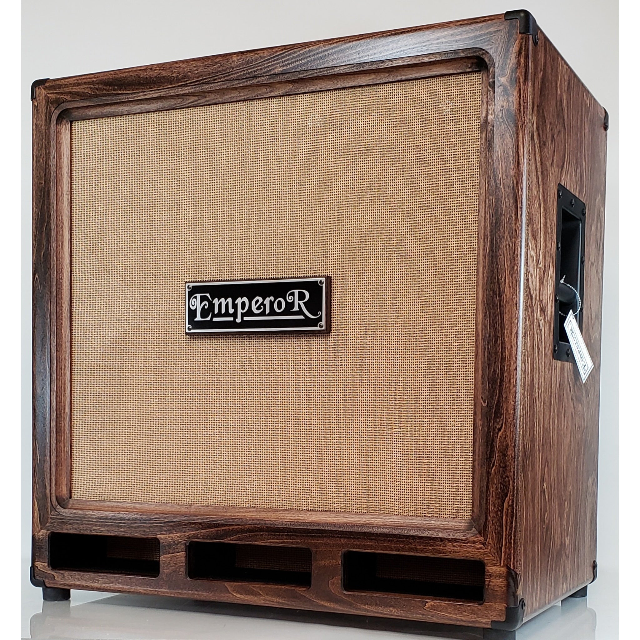 a 4x10 bass speaker cabinet with a tan grille
