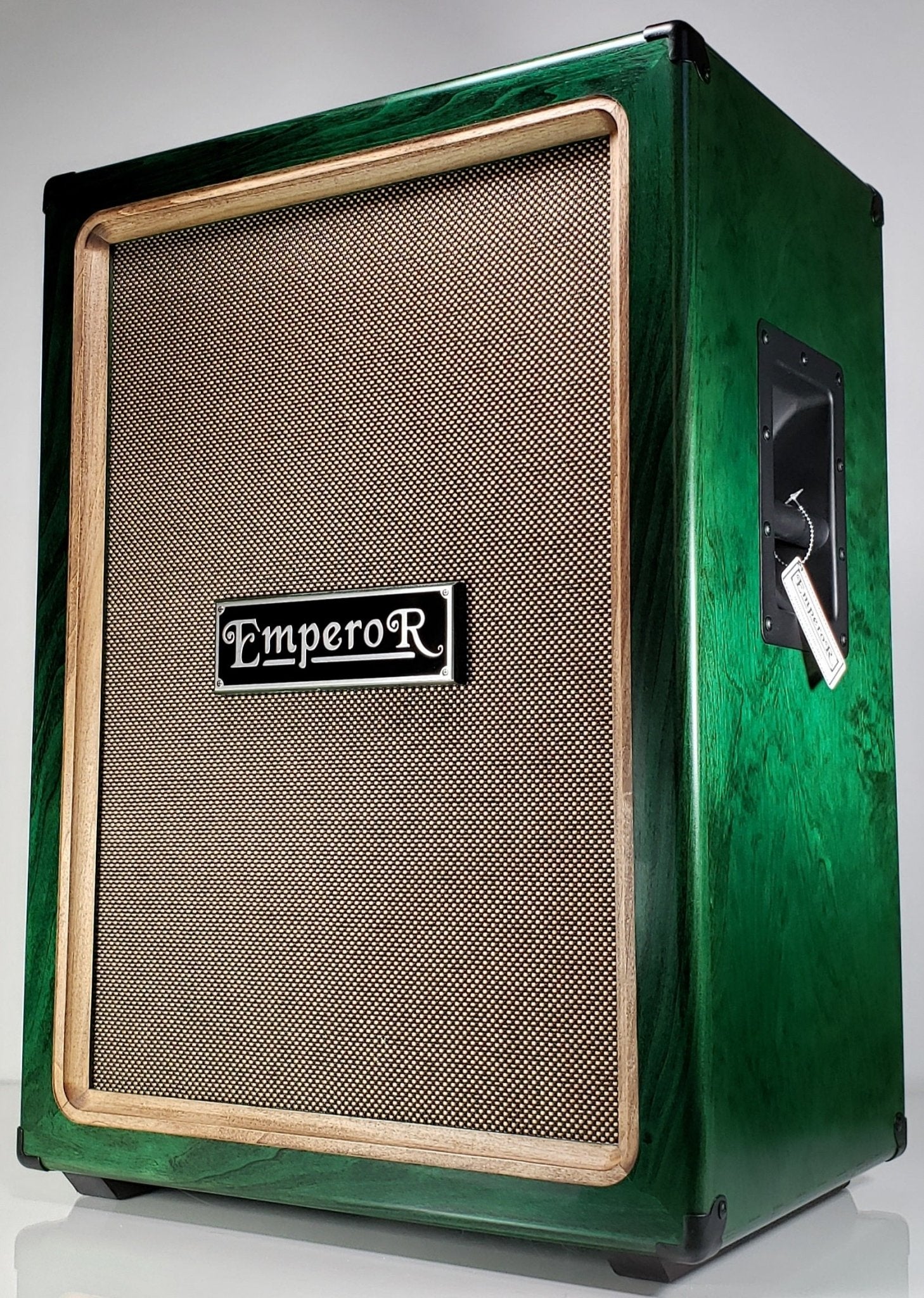 a green vertical 2x12 guitar speaker cabinet
