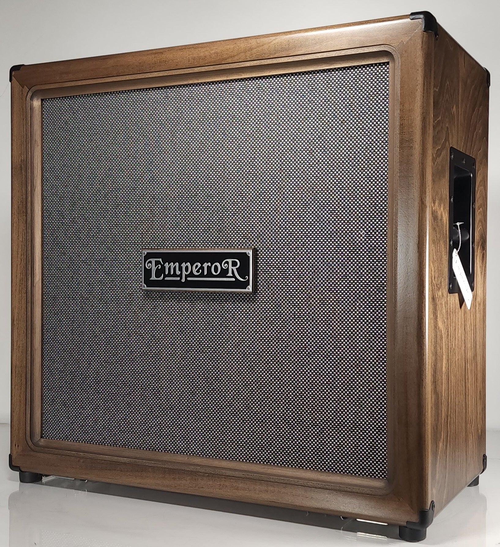 a 4x12 guitar speaker cabinet with a brown stain